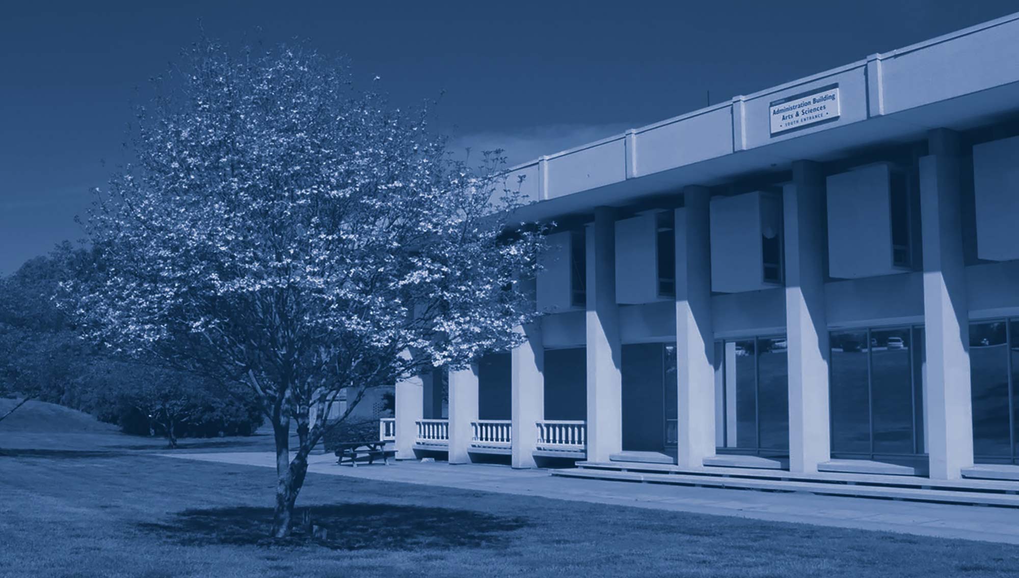 Large scenery photo of rear side of Administration building