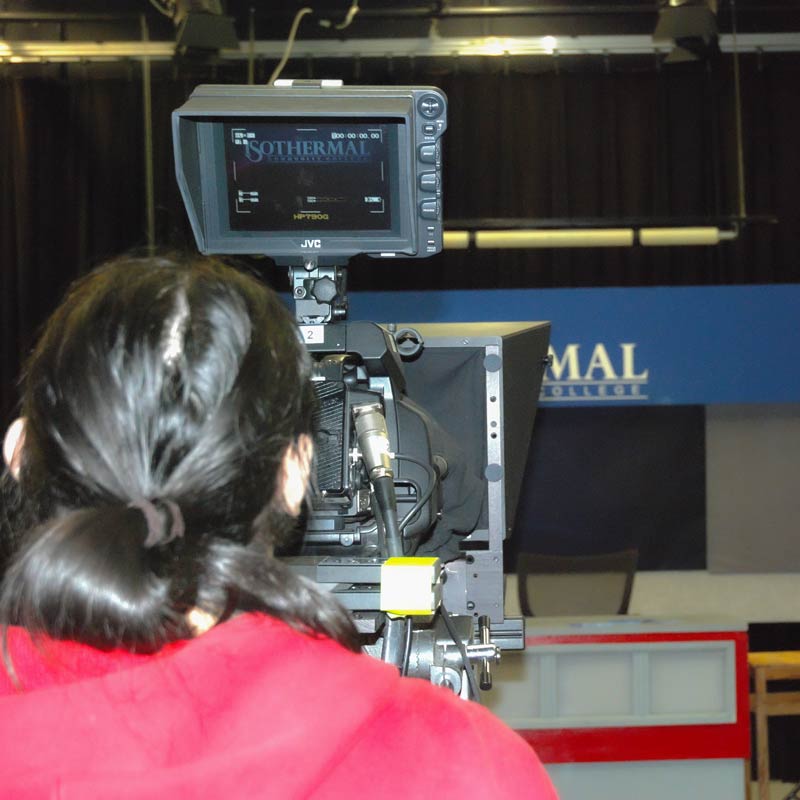 Student using one of the broadcast quality cameras in Studio A
