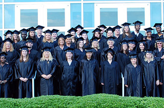 Adult High School graduation group photo of alumni on steps