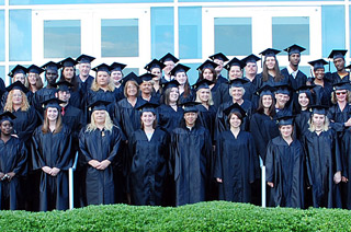 Adult High School graduation group photo of alumni on steps