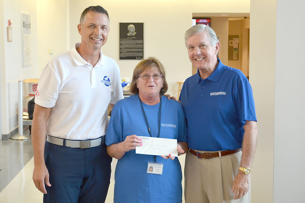 Tanner Staff ward winner, Tammy Fowler, receiving award with V.P. Thad Harrill and President Walter Dalton.