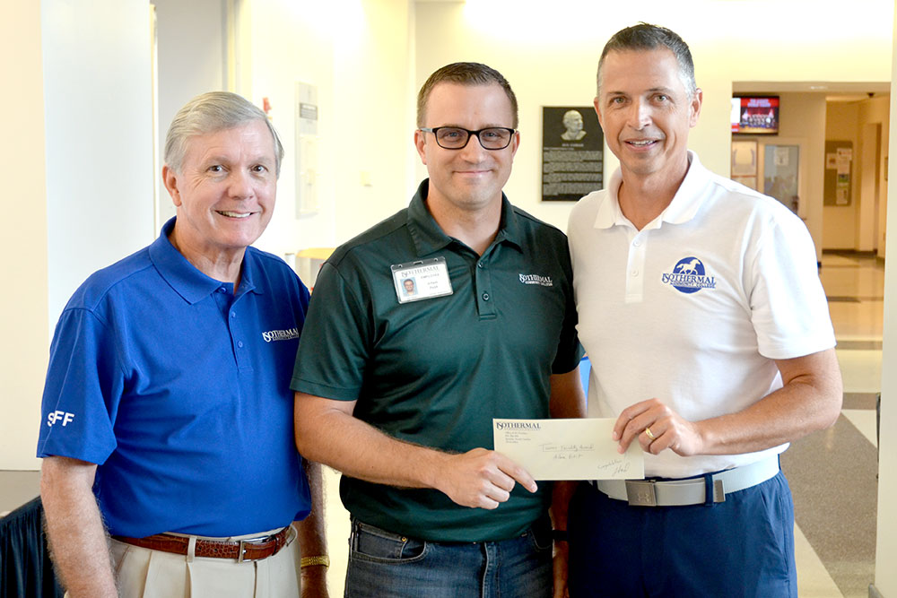 Tanner Faculty Award winner, Adam Petit, receiving award with V.P. Thad Harrill and President Walter Dalton.