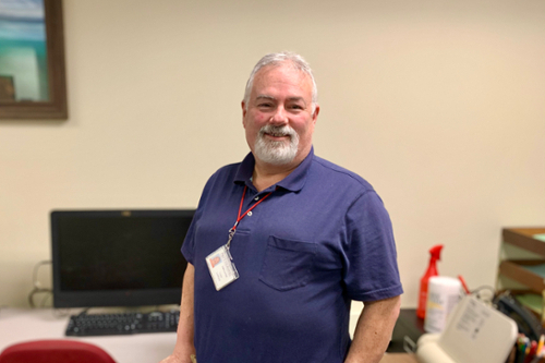 Todd Ledford standing in Tutoring Center Todd Ledford standing in Tutoring Center