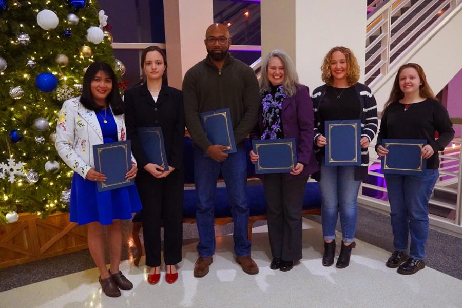 Group of 6 recipients holding awards