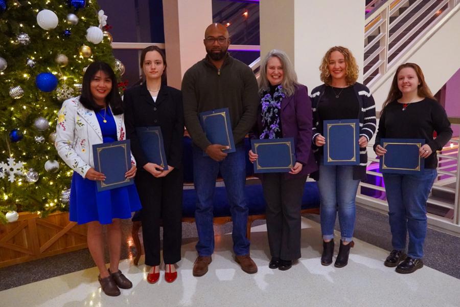 Group of 6 recipients holding awards