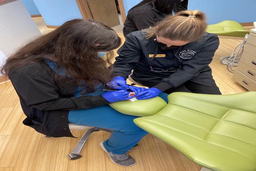 dental student working on mannequin