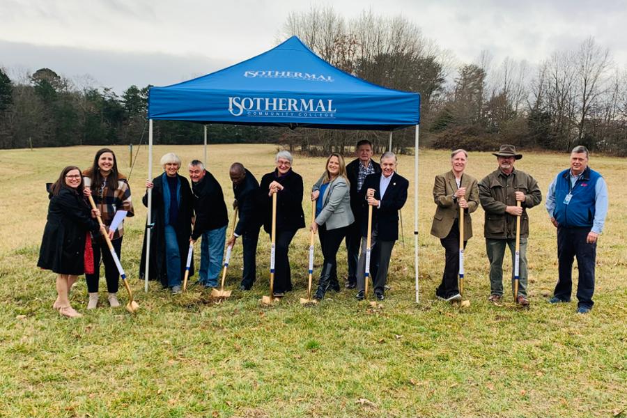 Trustee along with other college leaders breaking the first ground with golden shovels at the build site