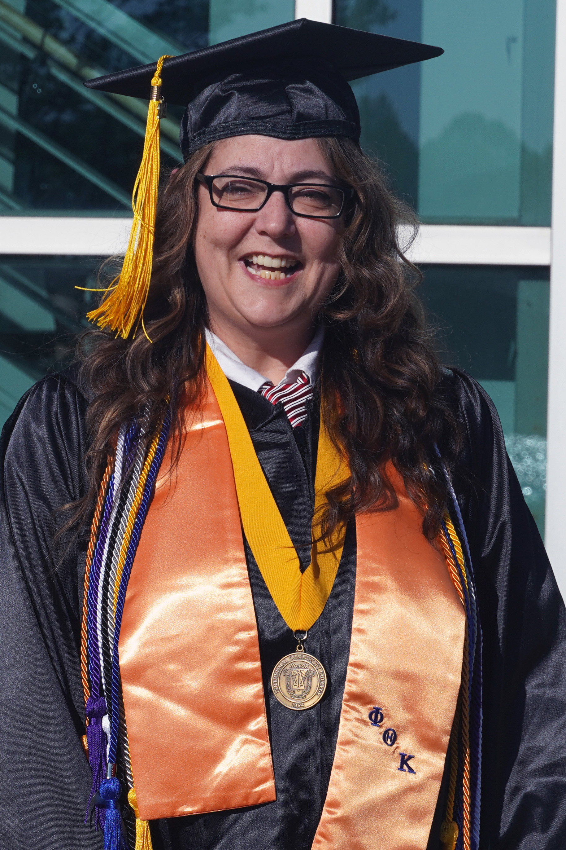 Jamie Marr in graduation regalia at the 2024 ICC Commencement